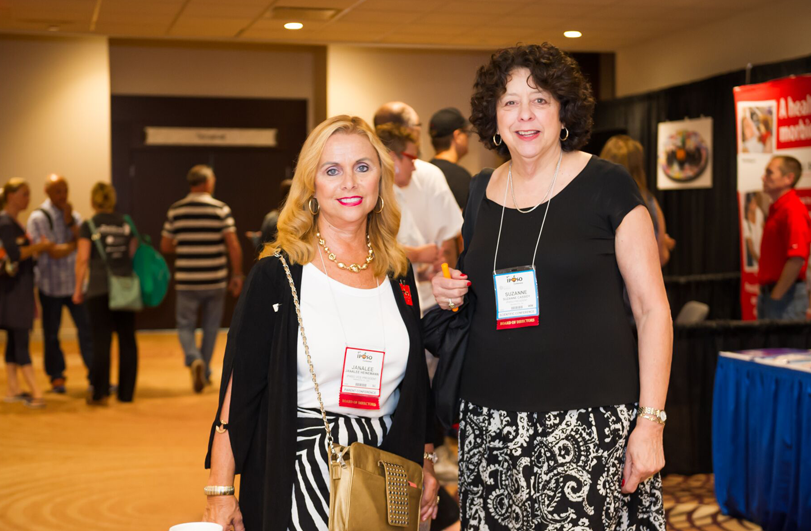 two ladies wearing black and white outfits