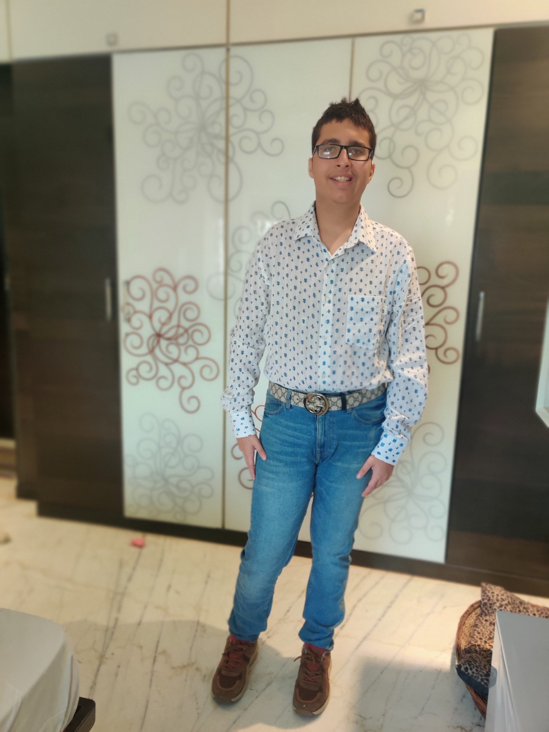 Young man in white shirt and blue denim jeans