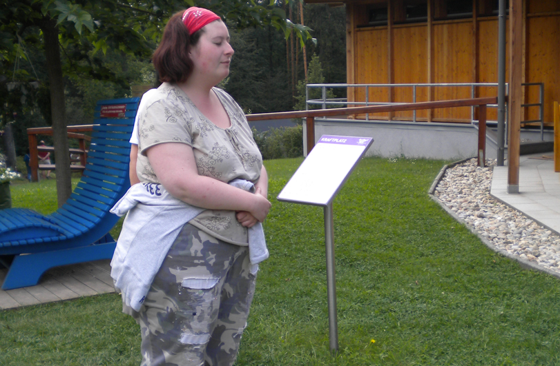 woman in garden singing