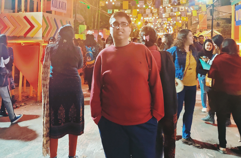 boy in red jumper at a festival