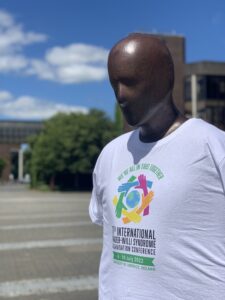 statue with conference shirt