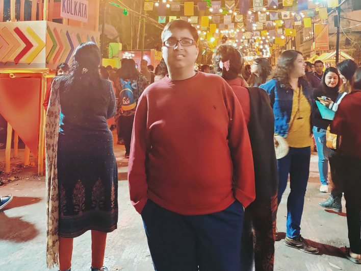 boy in red jumper at a festival